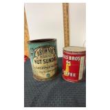 2 tin cans Brownie brand nut sundae.  Has hole in