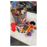 Popcorn tin full of miscellaneous happy meal kids