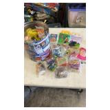 Popcorn tin full of miscellaneous packaged happy