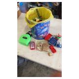 Tin full of miscellaneous happy meal kids toys.