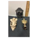 2 cast iron decorative accent pieces and brass
