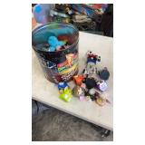 Popcorn tin full of opened Furbys from  McDonalds