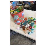 Popcorn tin full of miscellaneous opened happy