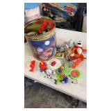 Popcorn tin full of miscellaneous opened happy