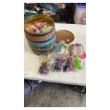 Tin full of miscellaneous unopened happy meal