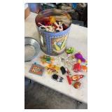 Popcorn tin full of miscellaneous opened happy