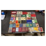 35 playing card sets with some sealed and  a