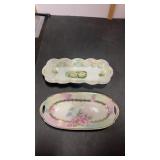 Two. Porcelain celery dishes with floral design.