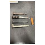 Railroad spikes.  1 forged into a knife, 1 made
