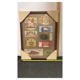 Framed collection of parts of cigar box labels