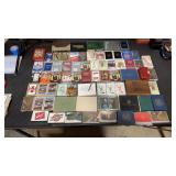 64 sets of playing cards. Some sealed