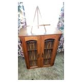Wooden 2 door cabinet  approximately  22 x 9.5 x