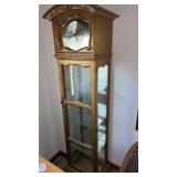 Curio cabnet with clock approximately  70 x 16 x