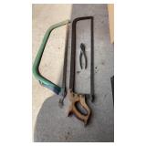 2 hand saws and pliers