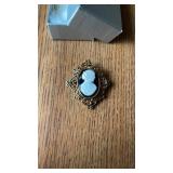 Vintage Cameo Brooch featuring white resin with a