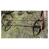 2 Antique Used Wagon Wheels and axle.  Yard Art