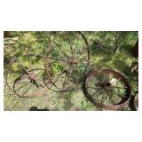 Group of 4 Antique Wagon Wheels some with Axles.