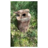 Anvil attached to log
