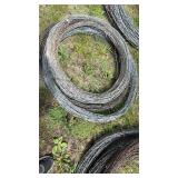 Stack of 4 unknown length rolls of Barbwire