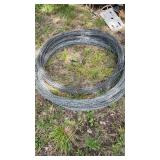 Stack of 3 unknown length rolls of Barbwire