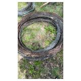 Stack of 4 unknown length rolls of Barbwire