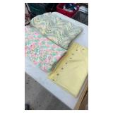 2 crocheted, baby blankets, and 1 yellow light