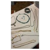 Silver tone and gold tone necklaces , bracelet