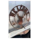 Round metal welcome sign with dear decoration,