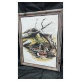 Framed painting of  2  ducks, swimming near a