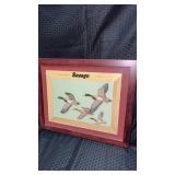 Framed and matted print features the savage brand