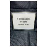 Framed sign No cooking in rooms state law.