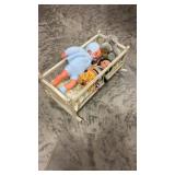 Toy wooden baby bed with dolls