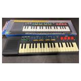 Mini Electronic Keyboard.  Works. In box. Box