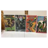 4 Green arrow comic books in plastic sleeve