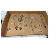 Silvertone earrings , necklaces , rings and pins/