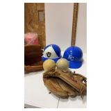 Group of baseball gloves , softball balls and