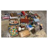 Assortment of board games, sprinklers, flags ,
