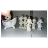 3 precious moment figurines And 2 tree ornaments