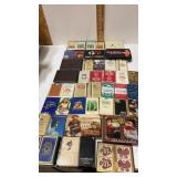 Assortment of playing cards. Some are sealed in