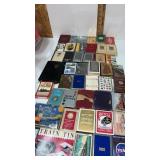 Assortment of playing cards some are sealed in