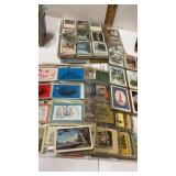 Loose single playing cards in plastic sleeves