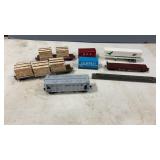 4 HO Scale Flat Cars, 1 Box Car, ï¿½ Semi Trailer.