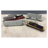 6 HO Scale Flat & Box Cars. Some partï¿½s missing