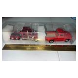 Semi truck and red truck