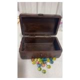 Wooden box with lid and marbles