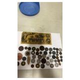 Lot of tokens and 3 dollar bill advertising