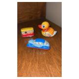 Small wind up tin toys duck, bus and car