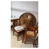 Oak round table with 6 chairs n basement