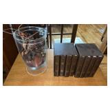 Photo albums and glass vase