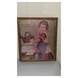 Advertising picture in ornate frame.  Frame has